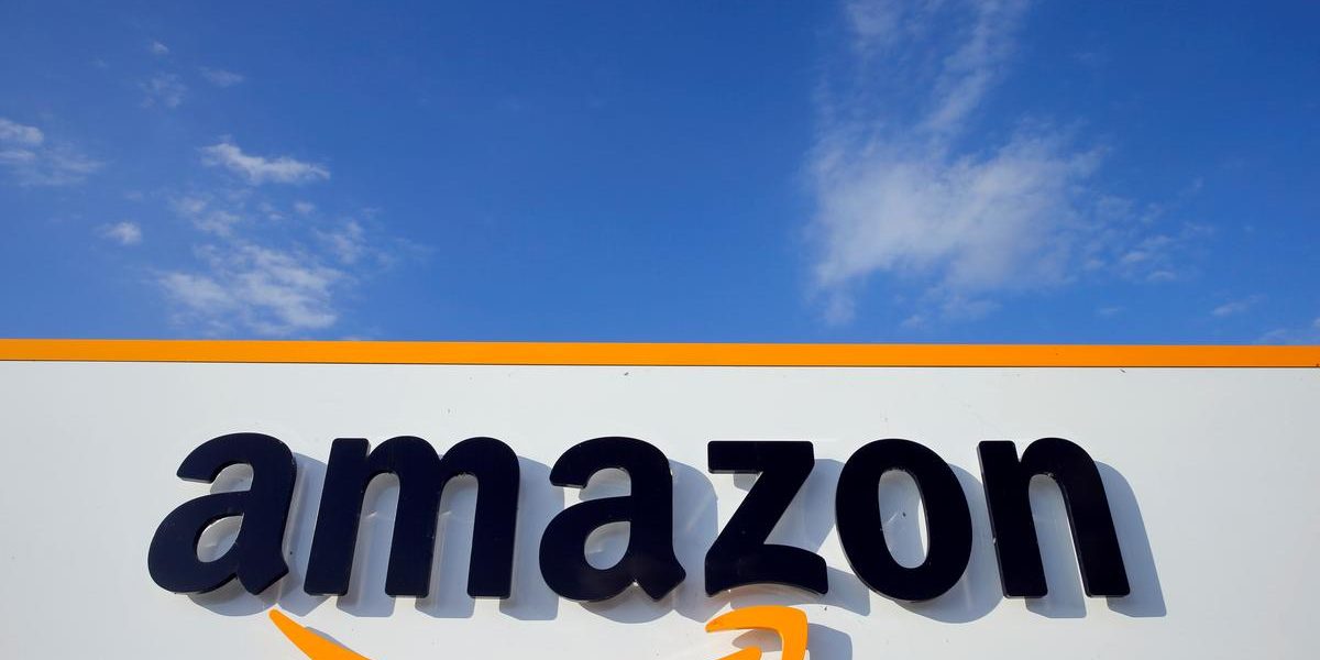 Amazon holiday sales jump as one-day shipping pays dividends, stock