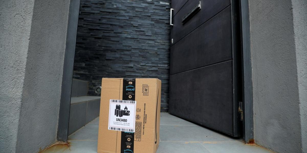 Exclusive: Amazon to deploy masks and temperature checks for workers