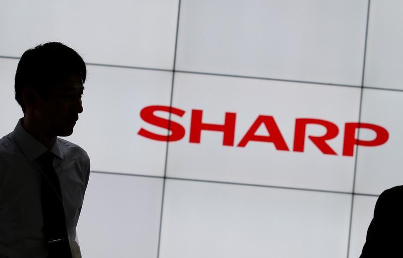Japan's Sharp halves full-year profit forecast as virus hits tech