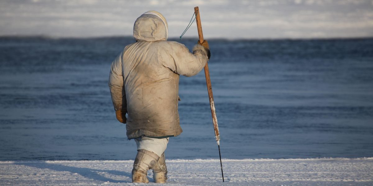 a-hunter-checks-the-ice-with-a-harpoon-near-a-polynya-traditional-tools-are-still-needed-for-ice-safety-in-addition-to-the.jpg